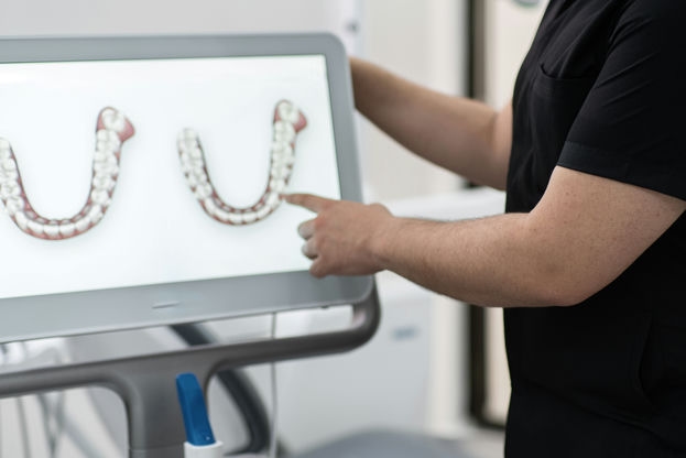 dentist showing human jaws models on digital scree 2023 11 27 04 51 24 utc c